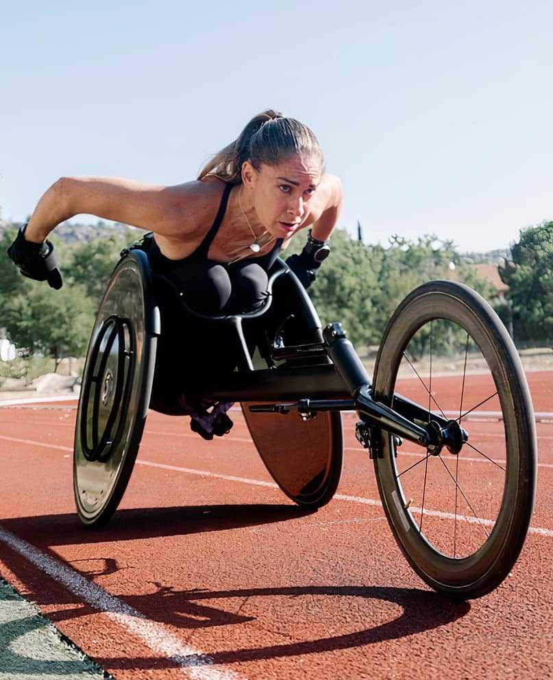 Woman handcycling on outdoor track